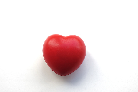 A red heart isolated on white background. Symbol of love.の写真素材