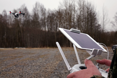 Drone remote control in hand man.Man operating of flying drone