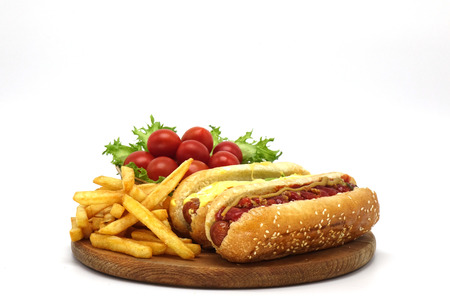 Hot dogs and French fries on white background.の写真素材