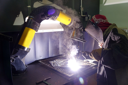 Welders working at the factory made metal. factory