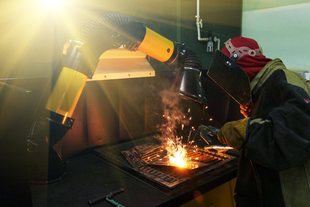 Welders working at the factory made metal. factoryの写真素材