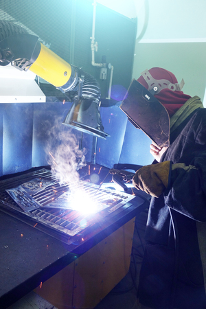 Welders working at the factory made metal. factoryの写真素材