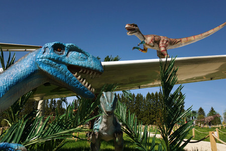 Russia. Vologda - 20 may 2018. Park with animals of the Jurassic period. The dinosaur and the plane of a film.のeditorial素材