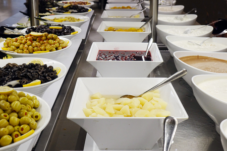 Olives and sauces on the buffet. assortmentの写真素材
