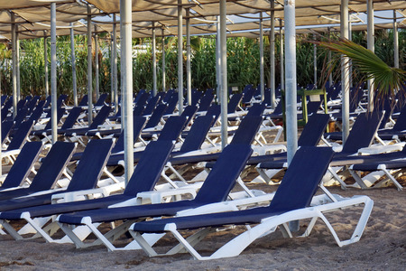 Sun loungers with umbrella on the beach. Tourism industry. relaxationの写真素材