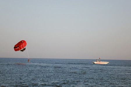 parachute on the high seas pulls powerboatの写真素材