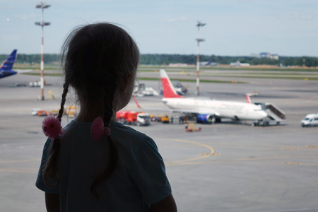 Young woman silhouette at the airport . The concept of air transportation.の写真素材
