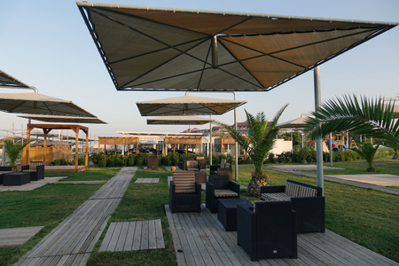 Sun loungers with umbrella on the beach. Tourism industry. relaxationの写真素材