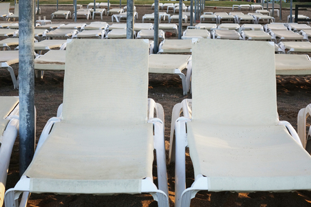 Sun loungers with umbrella on the beach. Tourism industry. relaxationの写真素材
