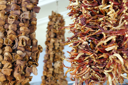 Dried spices hanging on the market, dried chili. Dried fruits.の写真素材
