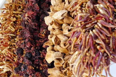 Dried spices hanging on the market, dried chili. Dried fruits.の写真素材