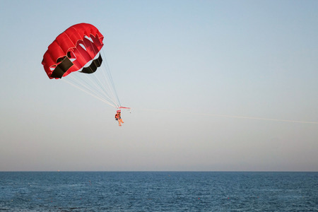 parachute on the high seas pulls powerboatの写真素材