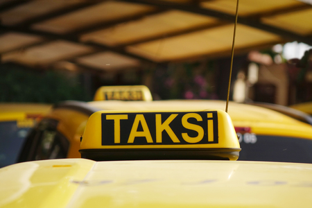 Taxi car roof sign on bokeh background in Istanbul of Turkeyの写真素材