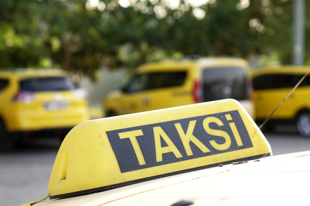 Taxi car roof sign on bokeh background in Istanbul of Turkeyの写真素材