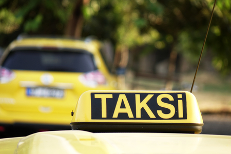 Taxi car roof sign on bokeh background in Istanbul of Turkeyの写真素材