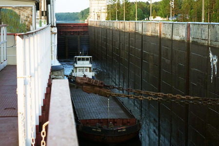 Vytegra. Russia. June 2018: Cargo barge is locked.のeditorial素材