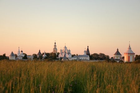 Vologda. Russia. June 2018: Orthodox Church and field at sunset. Spaso-Prilutsky monastery.のeditorial素材