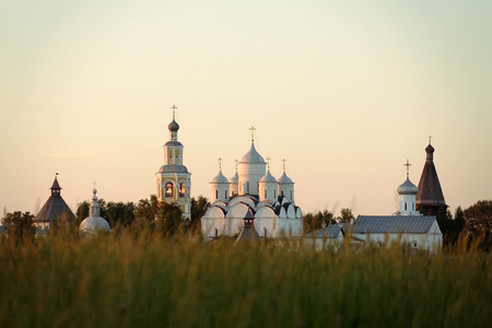 Vologda. Russia. June 2018: Orthodox Church and field at sunset. Spaso-Prilutsky monastery.