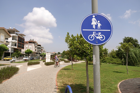 Turkey.Manavgat-June 2018. Cyclist & pedestrian road sign. Traffic in town.のeditorial素材