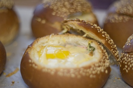 Buns with liquid egg, bacon and melted cheese.Egg, cheese and bacon sandwiches. Hot breakfastの写真素材