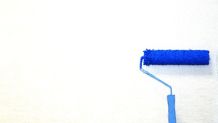 The roller paints the wall blue. officeの写真素材