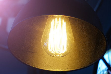 Black decorative lamp.Modern Lamp isolated on dark backgroundの写真素材