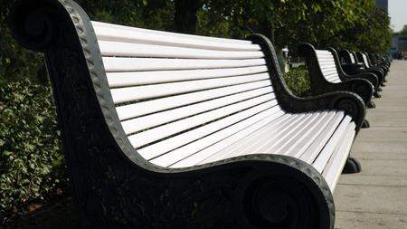 Cast iron benches with wooden slats for seats