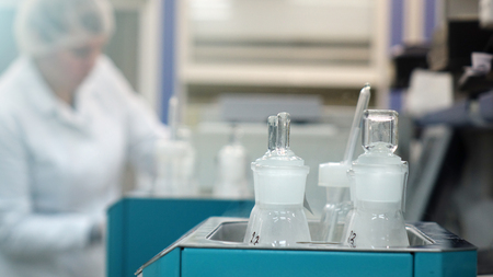 A female laboratory assistant checks samples of dairy products in the laboratory.の写真素材