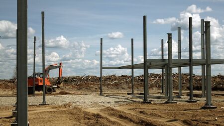 Construction of the shop of metal .Workers and equipment on the construction site.の写真素材