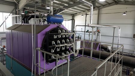 steamshop with new equipment. Production of thermal energy by burning wood waste.の写真素材