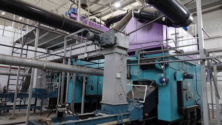 steamshop with new equipment. Production of thermal energy by burning wood waste.の写真素材
