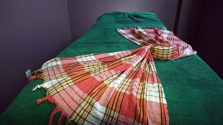 Green massage table with towel. A place to relax in the modern Wellness centre.の写真素材