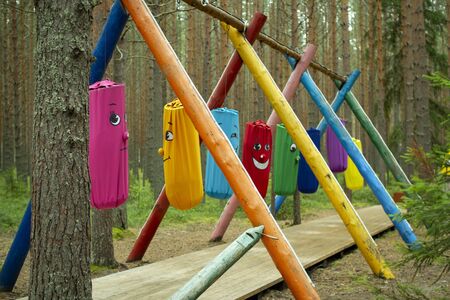 Obstacle course with colorful bags in a forest