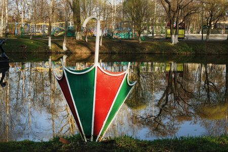 The metal umbrella is used as a flower bed in the city Park . Decoration of flower beds with various plants and umbrellasの写真素材