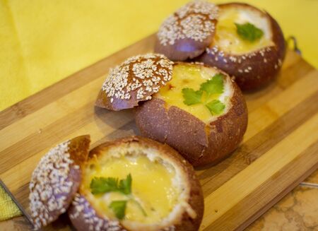 Buns with egg, bacon and melted cheese. Hot breakfastの写真素材