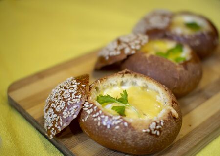 Buns with egg, bacon and melted cheese. Hot breakfastの写真素材