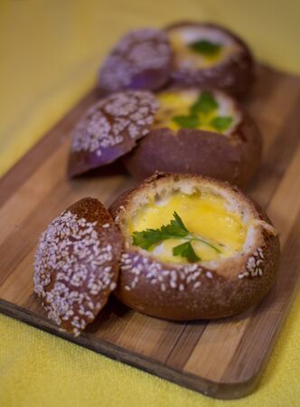 Buns with egg, bacon and melted cheese. Hot breakfastの写真素材