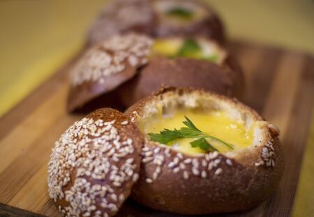 Buns with egg, bacon and melted cheese. Hot breakfastの写真素材