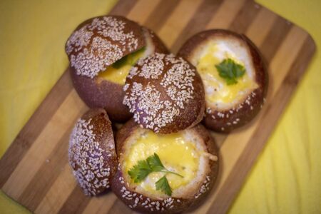 Buns with egg, bacon and melted cheese. Hot breakfastの写真素材