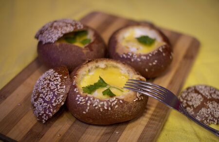 Buns with egg, bacon and melted cheese. Hot breakfastの写真素材