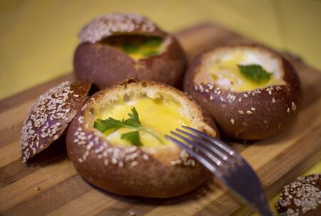 Buns with egg, bacon and melted cheese. Hot breakfastの写真素材