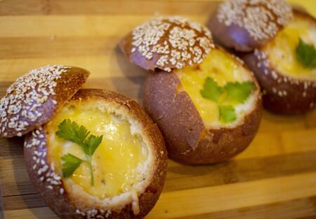 Buns with egg, bacon and melted cheese. Hot breakfastの写真素材