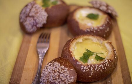 Buns with egg, bacon and melted cheese. Hot breakfastの写真素材