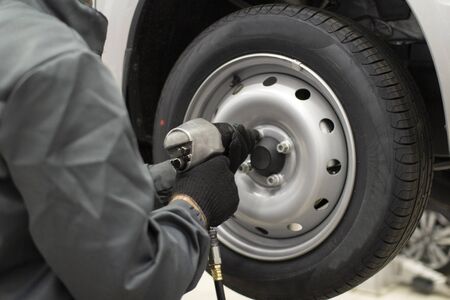 Tire service.Automatic fastening of wheel bolts.の写真素材