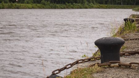 Rusty metal mooring bollard for a large ship.の写真素材