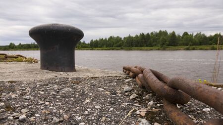 Rusty metal mooring bollard for a large ship.の写真素材