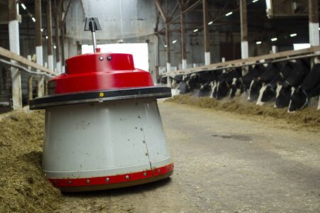 The robot farmers are programmed to work in the farm premises for animal feeding.の写真素材