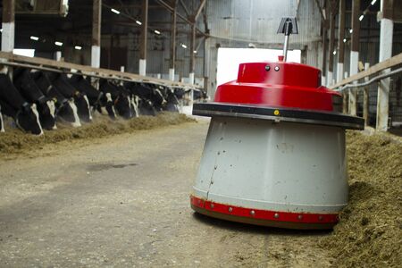 The robot farmers are programmed to work in the farm premises for animal feeding.の写真素材