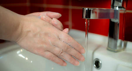 Wash your hands with liquid soap. Prevention of coronavirus-destruction of pathogenic bacteria.
