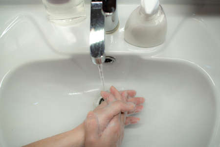 Prevention of coronavirus-destruction of pathogenic bacteria. Wash your hands with liquid soapの写真素材